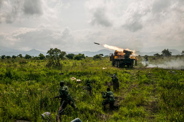 Congolese forces fire rockets toward M-23 rebel positions north of Goma. (Pete Muller for the New York Times)