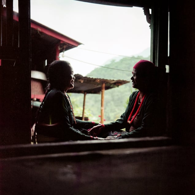 Lokmaya and Tilmaya talk on the front porch of Tilmaya’s house in Thulobesi. Lokmaya finds solace in sharing her troubles with Tilmaya. They often reminisce about their childhood and the mischief they got into.