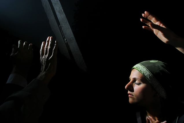 Jerusalem, Apr 06 - Christian pilgrim praying next to Jesus tomb in the Holy Sepulcher church © Natan Dvir