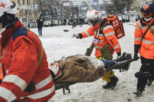 Doctors take away the victim after clashes between riot police and protesters. Kiev Jan. 22, 2014.