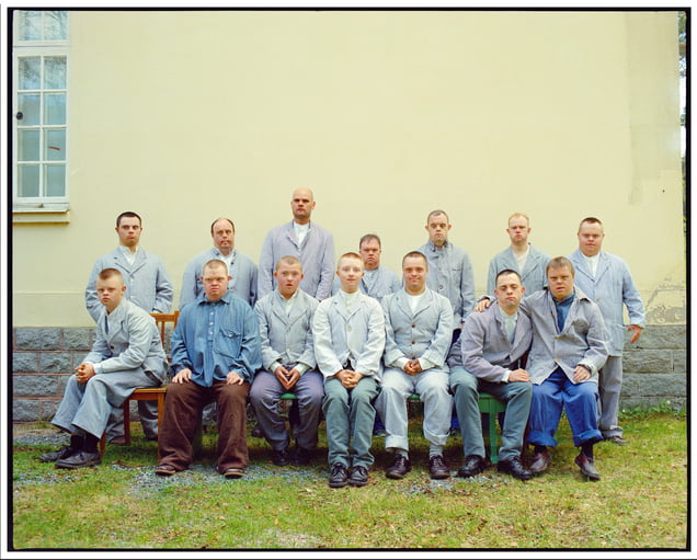 The Group Photo. In the film “IT COULD HAVE BEEN US,” the inmates of the Vipeholm Institution are visited by a photographer who takes a group photo. Niclas, Erik, Max, and their friends line up in front of me. I can tell it’s a challenge for them to be there. Joy and seriousness—a mix of emotions. It could have been us. © Magnus Laupa