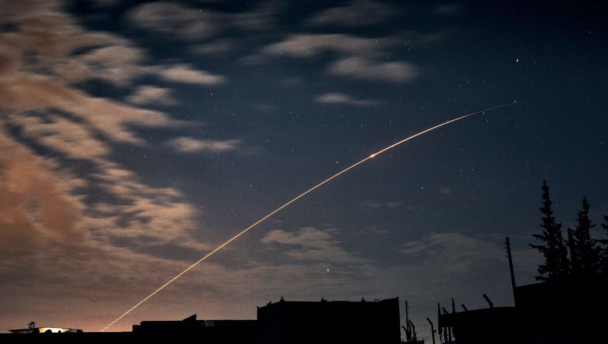A missile fired by the Syrian government forces flies in an arc over Aleppo on the evening of April 18, 2013. Syrian government shelling is a constant in the country's brutal civil war. © Nish Nalbandian