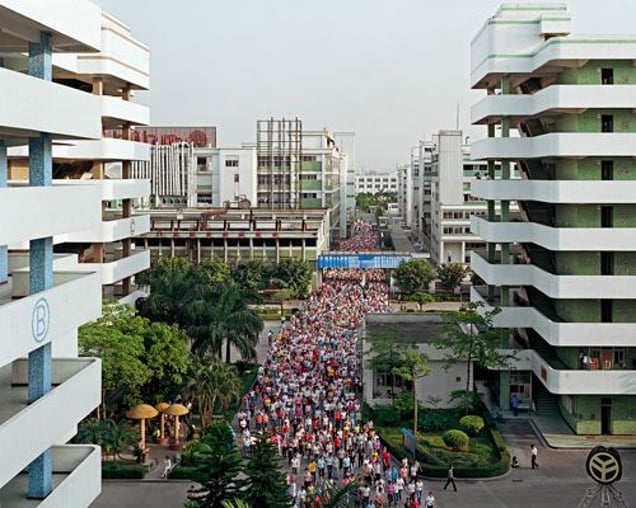 Manufacturing #2, Shift Change, Yuyuan Shoe Factory, Gaobu Town, Guangdong Province, 2004 © Edward Burtynsky