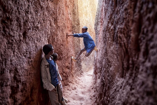 Lalibela, Ethiopia: Kids playing on the corridors of Bet Mariam © Matjaz Krivic