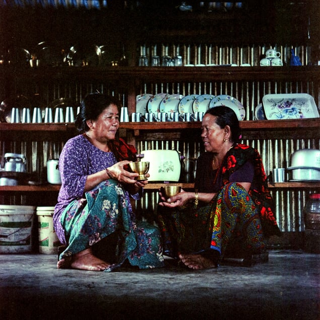 Maitamaya Gurung (left), 55, and Bhilimaya Mahato, 56, are from different ethnic backgrounds. They talk over a glass of chhyang (millet beer) when they meet at Maitamaya’s house and a glass of mohi (buttermilk) at Bhilimaya’s house. Their friendship blends cultures and practices.