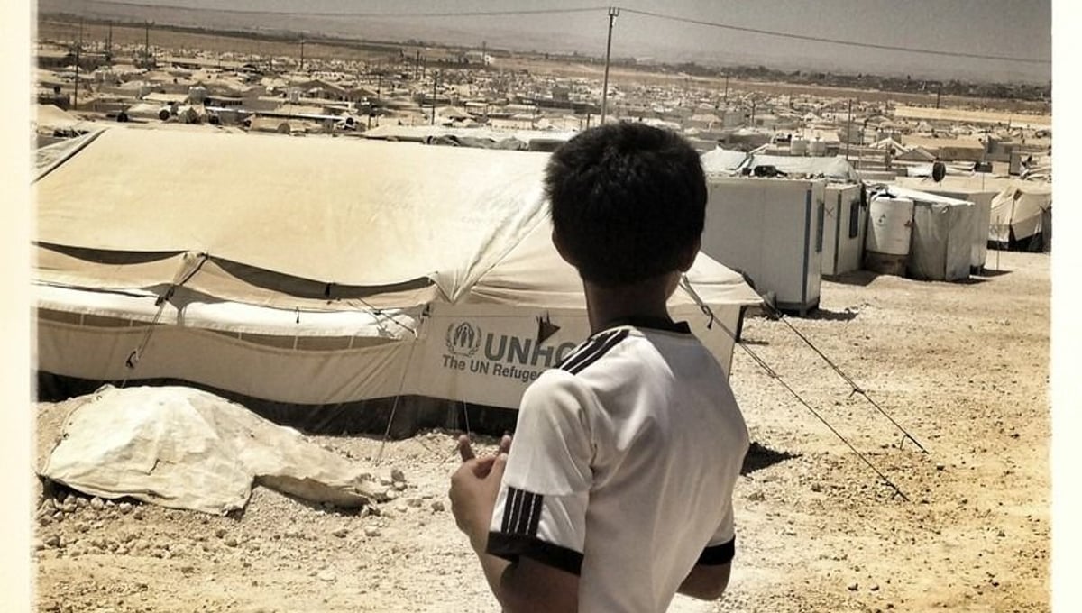 A young boy looks out over Za'atari