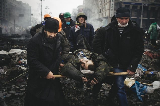 Injured and killed by snipers were carried out under fire to field hospitals to provide medical assistance. Kiev, Feb. 20, 2014.