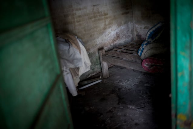 Indonesia, North-Bali,  18. April 2013 - A moldy dark shack was the home of a the mentally ill Wayan Budiawayan who were chained for 18 years to this bed. © Christian Werner