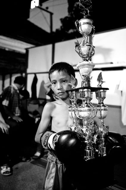 Boy with trophy after he has won the boxing match. © Sandra Hoyn