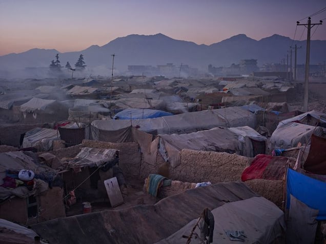 Historically, Kuchis were strongly pro-Taliban; feelings made more intense by being bombed by NATO off their traditional grazing lands in Helmand. They are allowed to set up camp here on Kabuls periphery only because it is below a large, new Afghan Army base.
© Simon Norfolk.