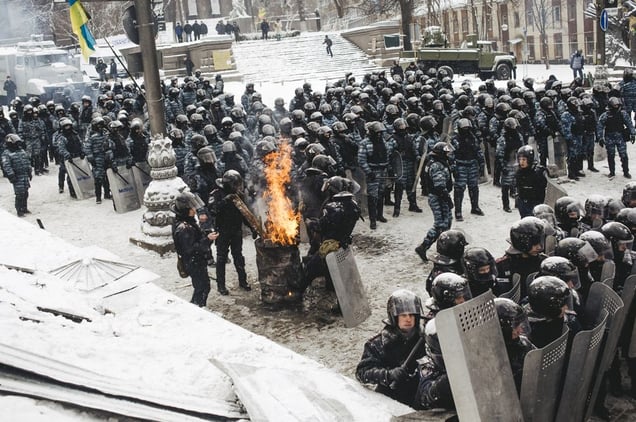 The police near the government district, basking near barrels with fire, as the air temperature sometimes reaches -30 degrees. Kyiv, Jan. 22, 2014.