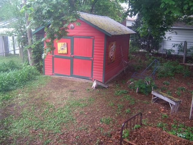 Studio house backyard with the garage.