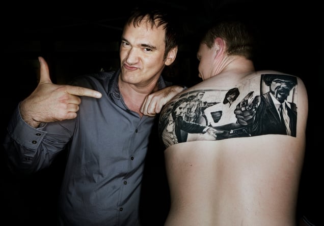 Quentin Tarantino visits Stockholm ahead of the premiere of his new film Inglourious Basterds. Jerker Mårgård catches the moment with his favourite director when he arrives. Jerker has tattooed his back with the most iconic scene from Pulp Fiction.