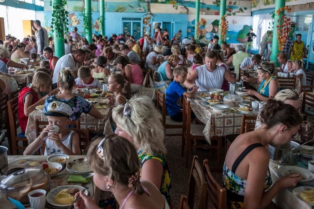 Ukraine, Zatoka Tourists eat lunch in a canteen in Zatoka, a cheap Black Sea resort destination in Ukraine popular with Moldovians.@ Petrut Calinescu