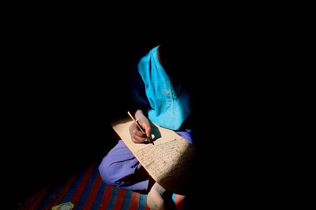 Djenné, Mali: A young boy studying Holy Koran at a medrassa school in Djenné. © Matjaz Krivic