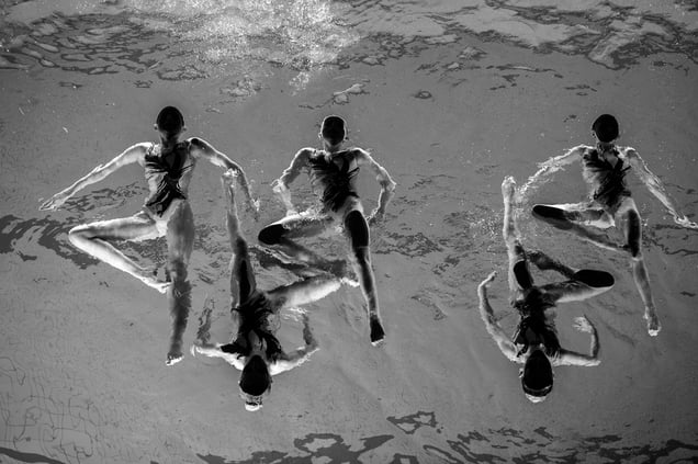 Members of the Neptun Synchro synchronized swimming team perform during a Christmas show in Stockholm, Sweden, on 13 December 2015.