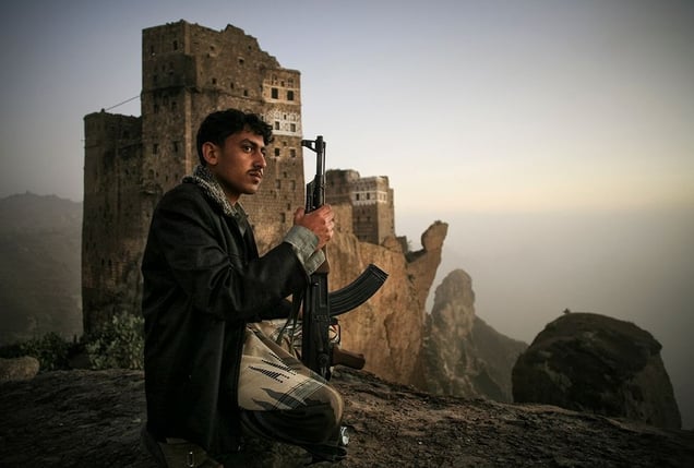 Shugruf, Yemen: A young man is guarding the khat fields in the valley below. © Matjaz Krivic