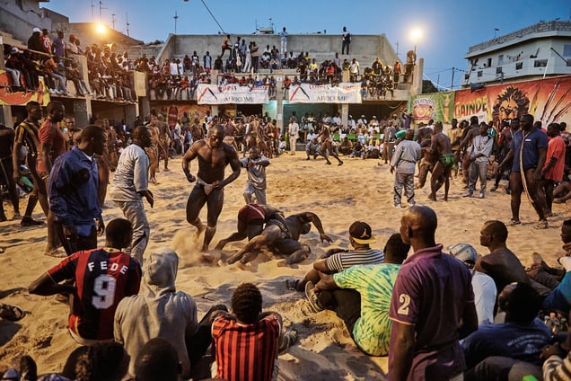 A tournament in the Adrien Senghor arena leans towards the end. The wrestlingfights take place in the late evenings when temperatures drop. Dakar, Sierra Leone, 28 March 2015.