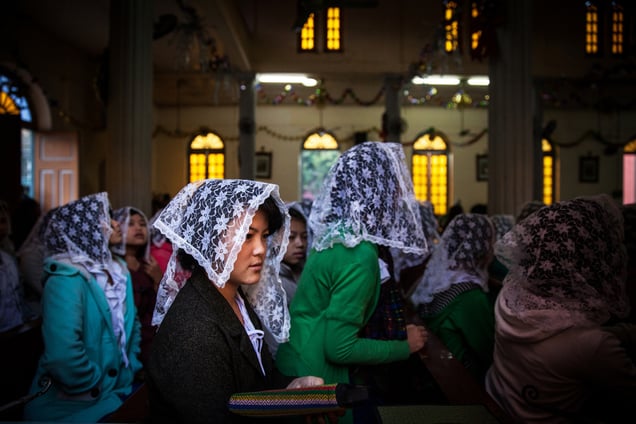 The Kachin are devout Christians in a predominantly Buddhist Burma. Worshippers at morning mass at St.Francis Savor Church in the Myitkyina, Myanmar.
