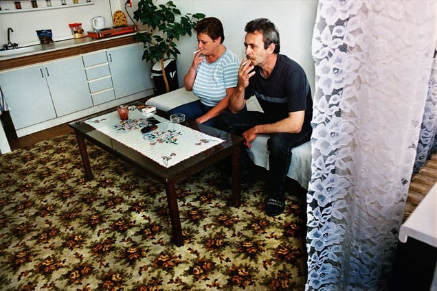 Daniela and Ladislav: unemployed couple smoking in a rented one-room flat, Pezinok, 2004. © Andrej Balco