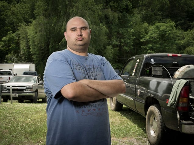 Shannon Pyle isn't a vendor or customer at Uncle Bill's Flea Market in Whittier, NC. He hasn't been able to work since he broke his back in an ATV accident, so he just hangs out the the market every weekend. Talking to the people there is his social life. © Forest McMullin