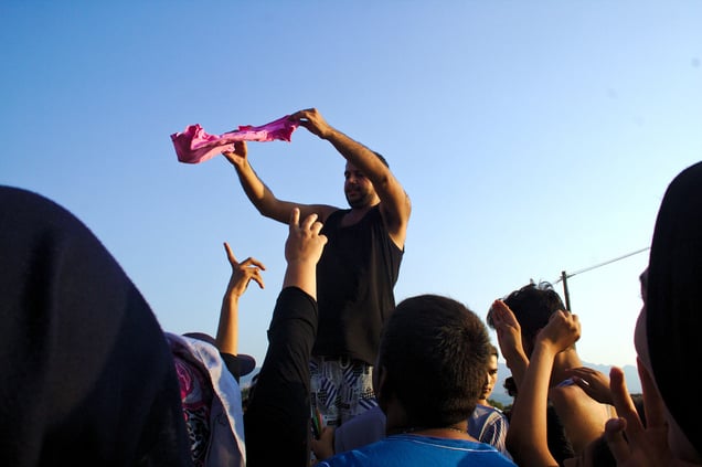 Distributing clothes at the Captain Elias resort