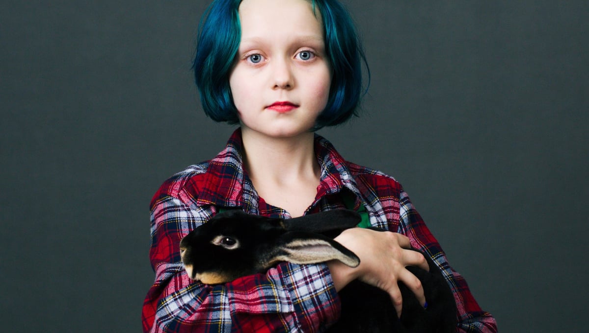 Virginia Anderson (10) from Dallas, Oregon with her bunny Romeo (6 months) of «Black Otter Rex» breed she just bought at the show.