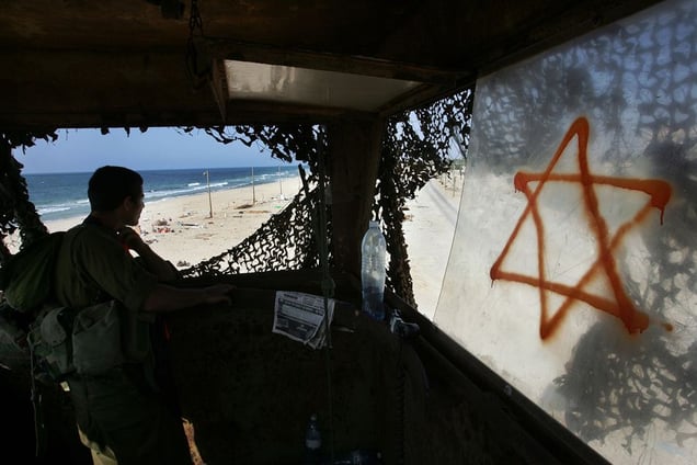 Shirat Hayam, Aug 05 - Israeli soldier watches from a watchtower the remains of the evacuated settlement © Natan Dvir