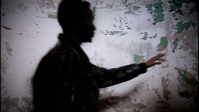 Rome, Italy (2010). Migrant in the once luxurious rooms of the abandoned Somali Embassy.