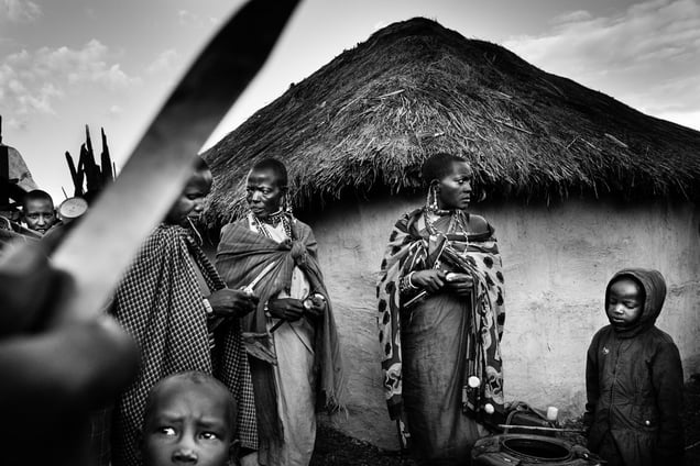 Women of the village peeling potatoes for the ritual dinner. © Meeri Koutaniemi