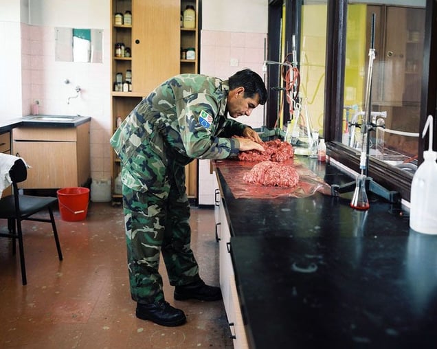 Army Cooks, Sarajevo, 2007. In order to survive we had to mix whatever we had, good and bad, into one mass of food. Five tons of meat that has just started to go off can be safely mixed with 10 tons of fresh meat. That way, we were able to provide enough protein supply for the people there without poisoning them. The harmful bacteria got spread equally between everyone. © Martin Kollar.