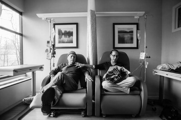 Howie calls these “his and hers” chairs. He sits beside Laurel, his wife of thirty-four years, as they get their weekly chemotherapy treatments, side by side at Oncologist Dr. Barry Boyd’s office. Greenwich, Connecticut. January, 2013 © Nancy Borowick