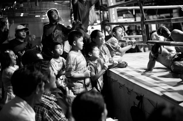 Spectators during a boxing match. © Sandra Hoyn
