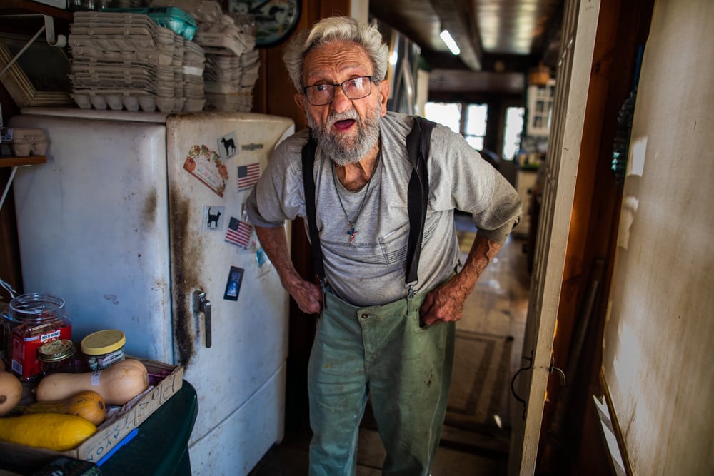 Ray. Every day, Ray sells eggs and vegetables to the locals. © Barbara Peacock