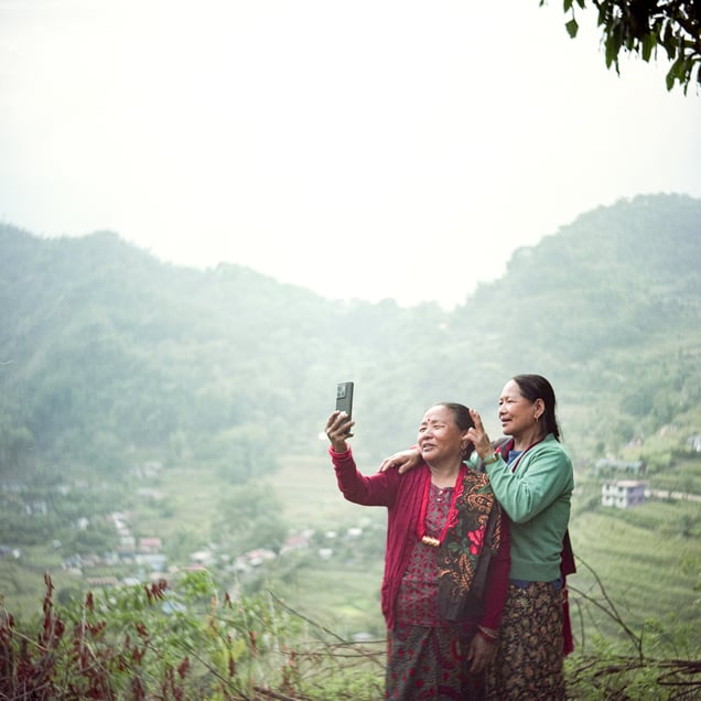 Although Paisamaya Gurung and Buddhimaya Tamang have been mitinis for almost 50 years, they didn’t have a picture of them together. Cameras were a novelty once, and taking a photo together never occurred to them. So I asked them to take a selfie together with their mobile phone.