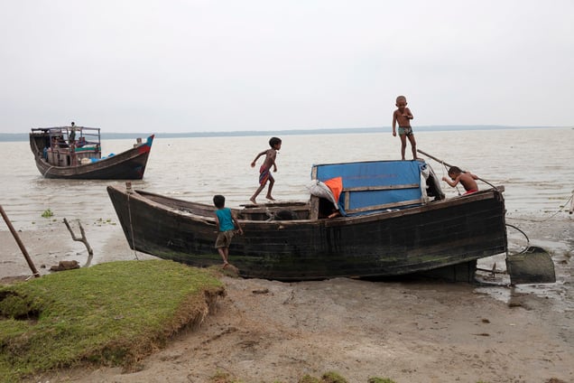 Children plying on a fishing boat at Patharghata in Barguna district in Bangladesh