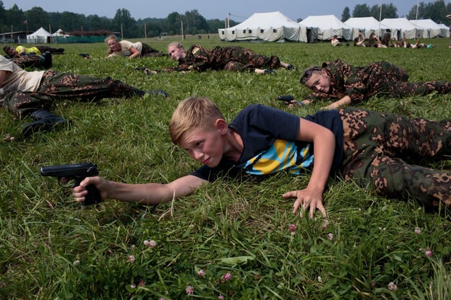 Students train in firearms at the Historical-War Camp, in Borodino, Russia. 24 July 2016. They are using air-soft guns for the practice and competition.
