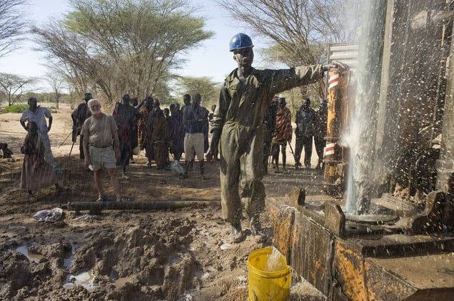 From the series Orizon, Turkana enclave in an area peopled by Pokots. Turkanas lead their herds of goats to water at the Kapedo river. They are escorted by police auxiliaries of the Kenyan Police Reserve.