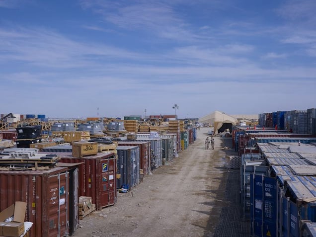 One of the huge logistics compounds at Camp Leatherneck. A modern, technologised army needs hundreds of thousands of different kinds of objects in order to keep it working. A $100m warplane can be grounded for the want of a $1 part. Supplying these things is a huge drain on an armys resources and its greatest vulnerability.
© Simon Norfolk.
