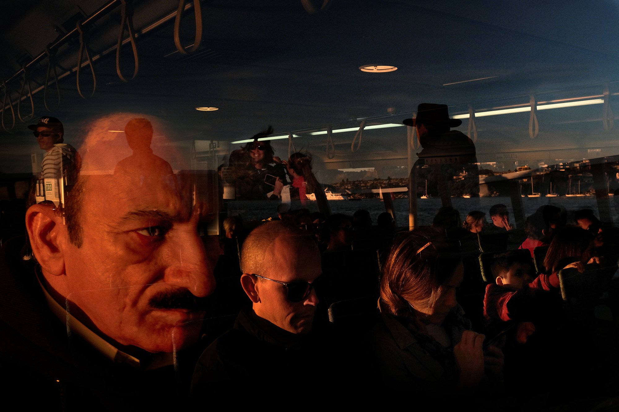 Untitled. Passengers commute on a packed Manly to Circular Quay ferry. A worldwide icon of Sydney, the 'Freshwater' ferries are both a rite-of-passage for any visitor to the harbour city and have become quintessential of Sydney life for those who use them for their daily commute. In April 2019, the NSW government announced plans to retire these ferries, sparking public debate and outrage. © Sam Ferris