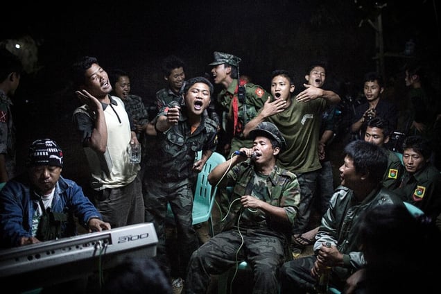 1st Prize Daily Life Single. Kachin Independence Army fighters are drinking and celebrating at a funeral of one of their commanders who died the day before. The city is under siege by the Burmese army © Julius Schrank, Germany, De Volkskrant