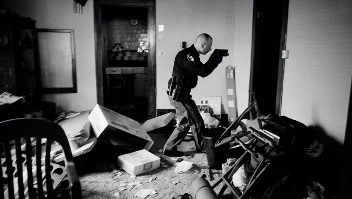 World Press Photo of the Year 2008. © Anthony Suau, USA, for Time. US Economy in Crisis: Following eviction, Detective Robert Kole must ensure residents have moved out of their home, Cleveland, Ohio, 26 March