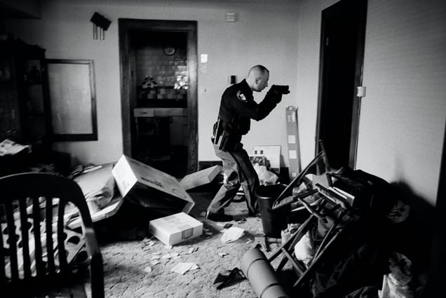 World Press Photo of the Year 2008. © Anthony Suau, USA, for Time. US Economy in Crisis: Following eviction, Detective Robert Kole must ensure residents have moved out of their home, Cleveland, Ohio, 26 March