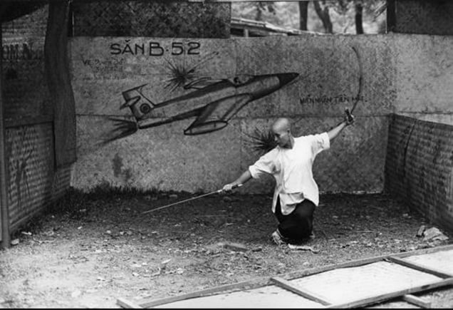 Vietnam.  Dance of the saber. 1985. From the book "War Photographer: Between Shadow and Light" © Christine Spengler