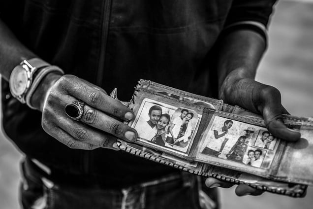 An Ethiopian migrant shows all he has with him