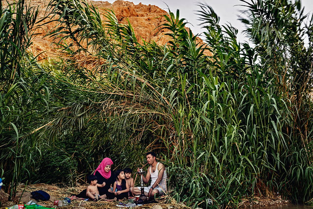 A family enjoys a family picnic in Al-Ouja Wadi near Jericho in the West Bank.