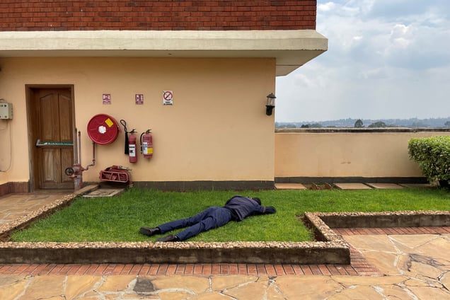 A worker rests during lunchbreak on the rooftop of an office building in Nairobi, the capital city of Kenya on January 10, 2024.