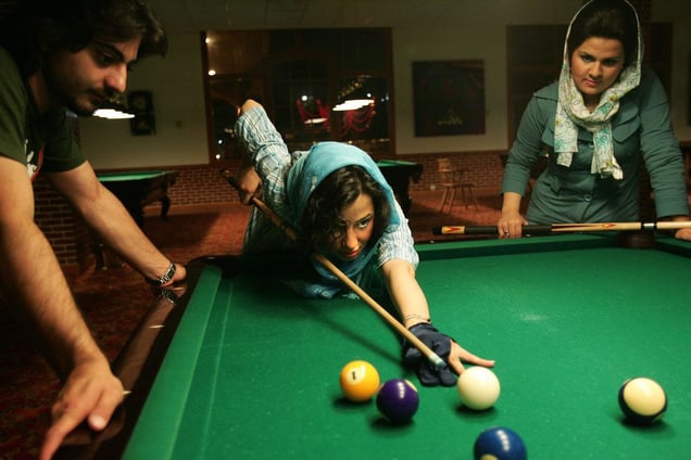 Upper-class youth visit Kish Island for leisure and fun. In Tehran, Islamic law prohibits women to play billiards. IRAN - April 2006
© Copyright 1979-2009 Alfred Yaghobzadeh. All rights reserved.