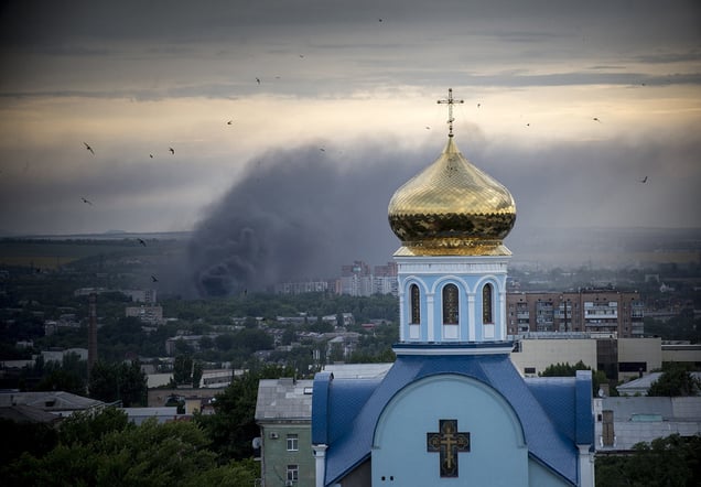 A smoke in the city of Luhansk during an artillery attack