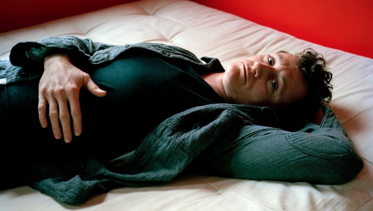Dallas lying on the bed